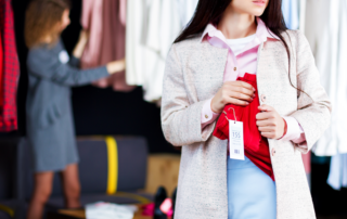 woman shoplifting at a clothing store