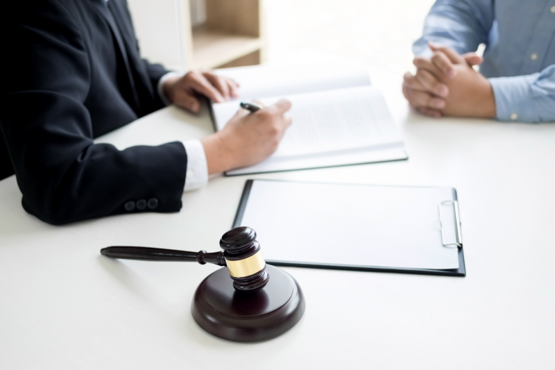 Photo of a trusted Chicago attorney consulting with a client who's been charged with shoplifting in Chicago